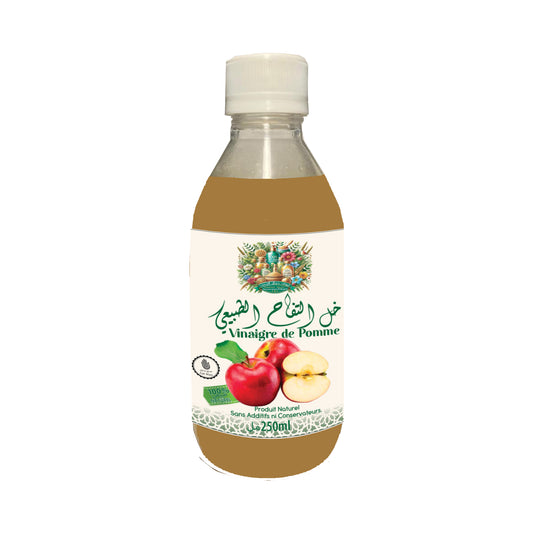 Bouteille de vinaigre de pomme artisanal fait main, naturel et pur, fabriqué dans une coopérative à Salé, Maroc.